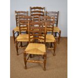 Group of six ladderback chairs and a tub chair
