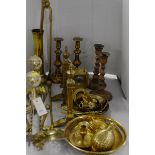 Brass andirons, fireside implements, and other brass items.