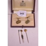 Gold cufflinks and three tie pins