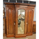 A Victorian mahogany three door breakfront wardrobe