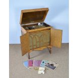 Fullotone: A '1932-33 model' oak cased gramophone, records, manual and needles.