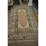 A Kurdy rug, the ivory ground with a central geometric design within floral meander and palmette