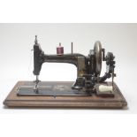 Vintage sewing machine and an Edwardian coal purdonium