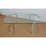 Designer glass coffee table with aluminium supports c1970's.
