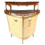 A mid 20th Century boat form cocktail bar,