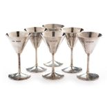 A set of six silver champagne glasses by Reid & Sons Ltd