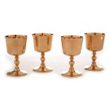 A set of four 9ct yellow gold goblets