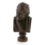 Bronze bust of Voltaire.