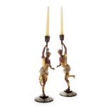 A pair of early 20th Century figural candlesticks