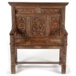 A Victorian oak carved hall seat