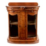 A Victorian walnut bowfront side cabinet, the shaped top above a carved frieze, two glazed bow front
