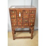 An Asian hardwood spice chest.