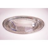 A silver dressing table tray