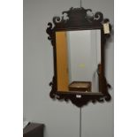 A Georgian style mahogany wall mirror.