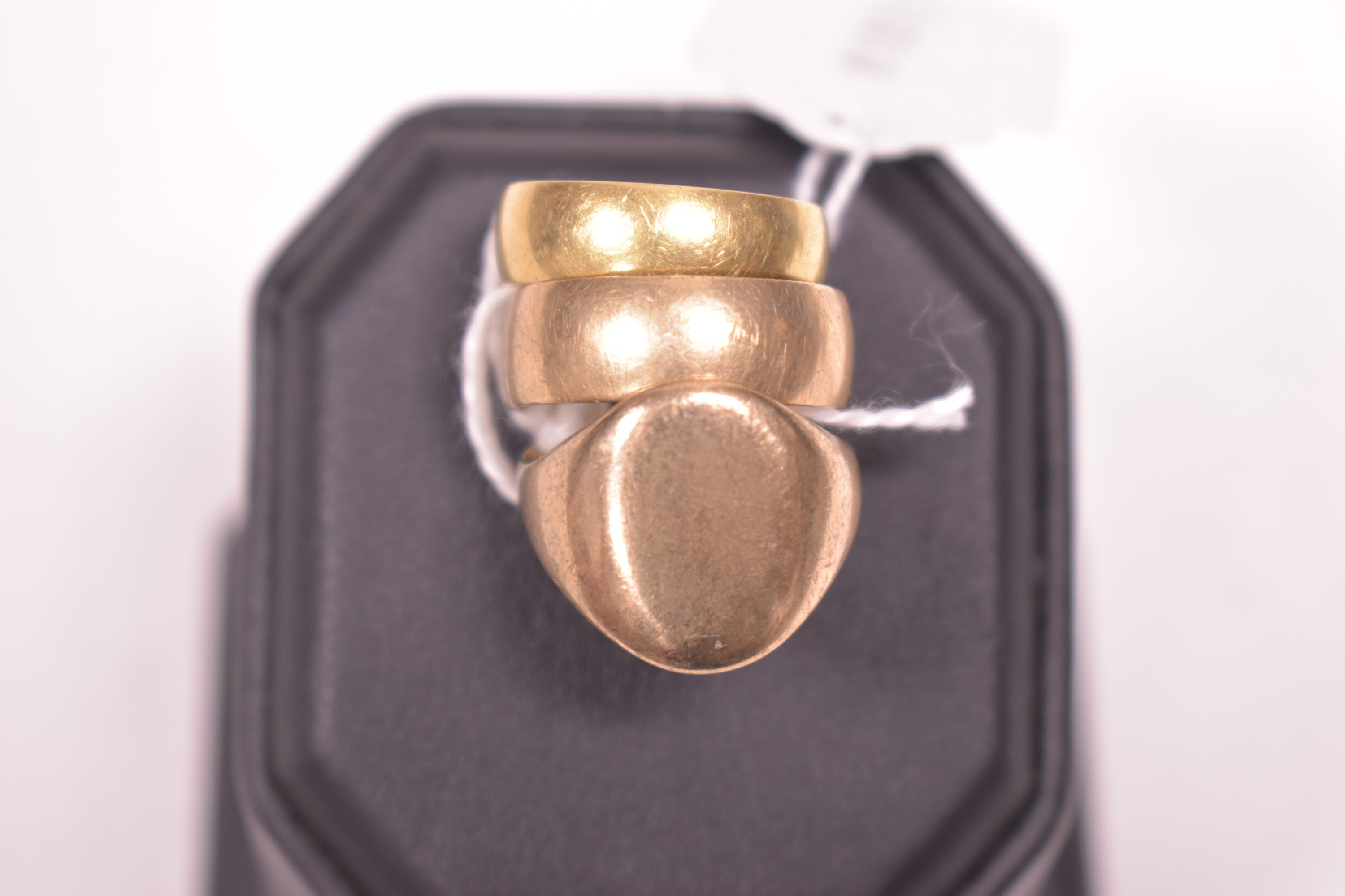 Two 9ct gold rings and an 18ct gold ring