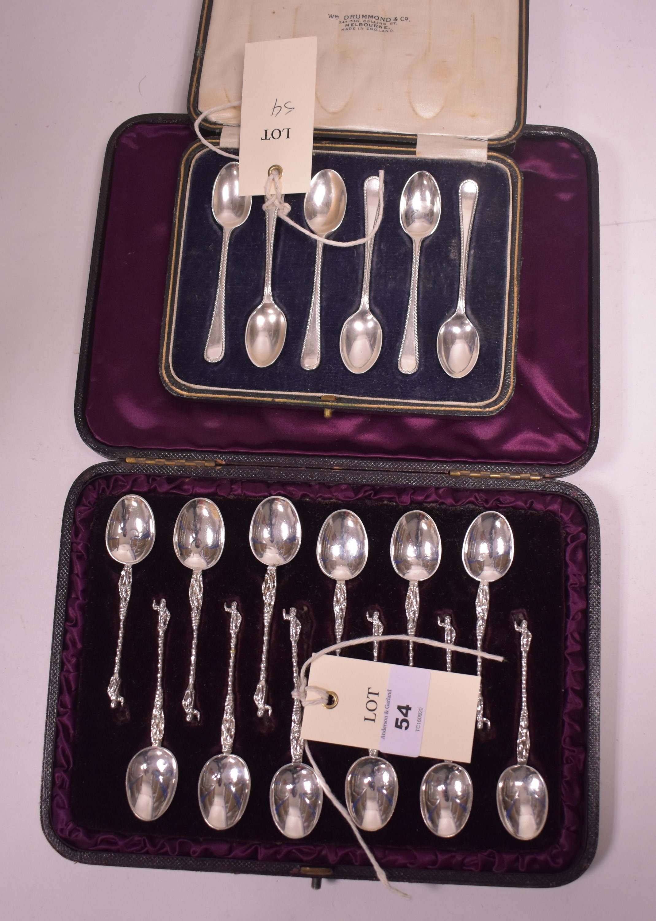 Two cased sets of silver spoons