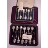 Two cased sets of silver spoons