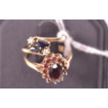 A sapphire and diamond ring and a garnet cluster ring