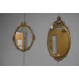 Two gold painted wall mirrors.