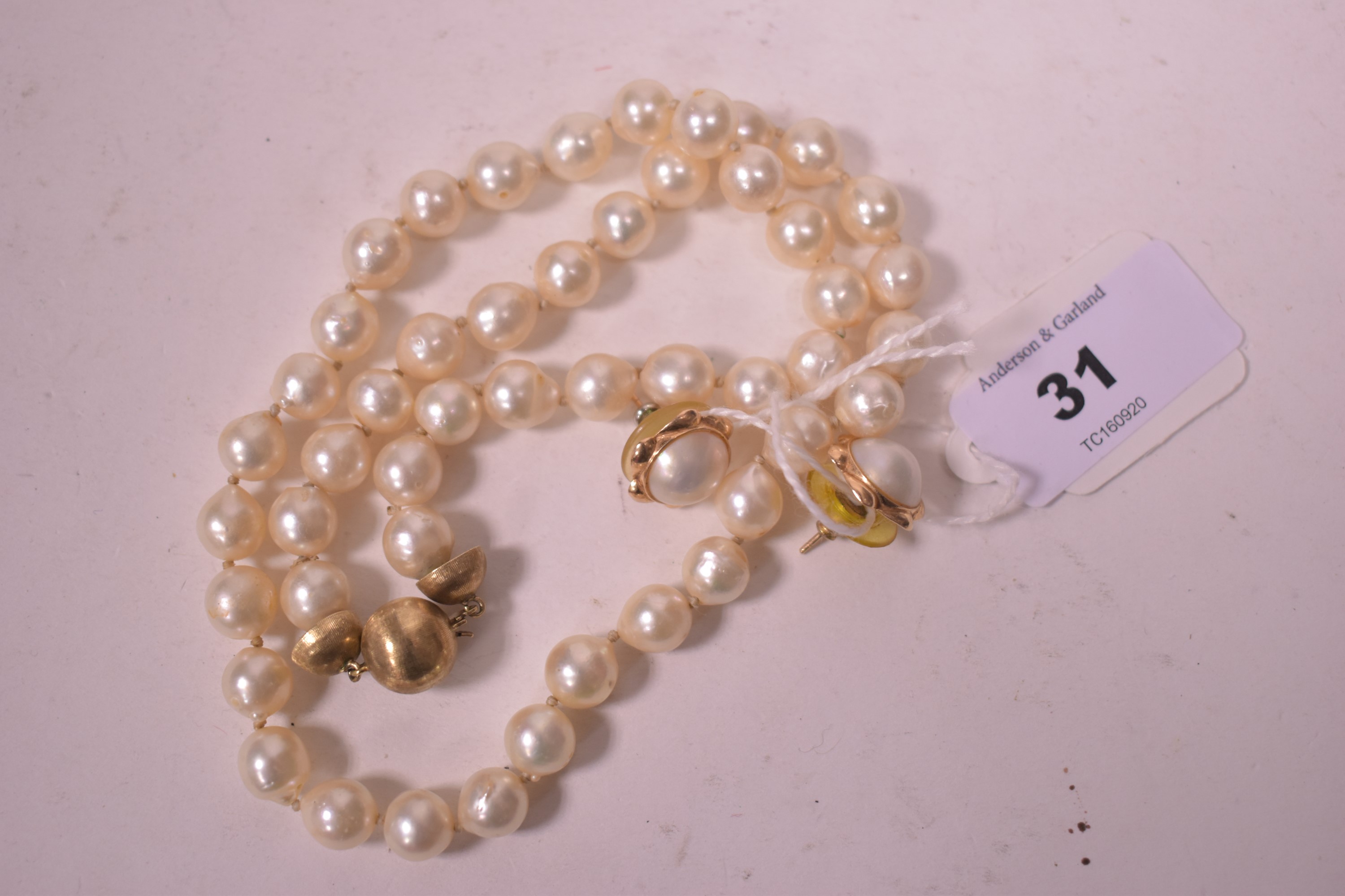 Cultured pearl necklace and earrings