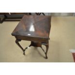 An Edwardian mahogany envelope card table