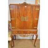 A mahogany cocktail cabinet