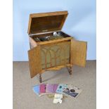Fullotone: A '1932-33 model' oak cased gramophone, records, manual and needles.