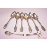 Silver spoons and sugar tongs