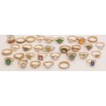 A large quantity of 9ct gold gem set rings