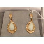 A pair of opal earrings