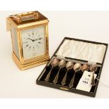 Set of silver teaspoons, and a carriage clock
