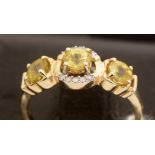 Yellow stone and diamond ring