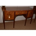 A Georgian mahogany bowfront sideboard.