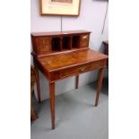 A 20th Century yew wood writing desk, with raised superstructure and writing surface above a