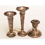 Two silver vases and a dwarf candlestick
