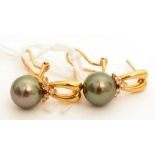 A pair of black cultured pearl and diamond earrings