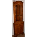 A walnut and burr walnut corner cabinet,