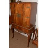 A mahogany cocktail cabinet