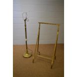 A brass gun rack and brass telescopic standard lamp