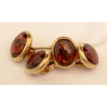 A pair of red stone cufflinks