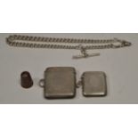 A silver watch chain, two vesta cases and a thimble