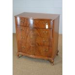 Mid 20th Century serpentine chest of four drawers.