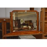 Shaped rectangular bevelled overmantel mirror.