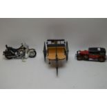 Three Franklyn Mint cars and motorcycle models.