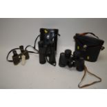 Two pairs of field glasses; and a pair of binoculars.