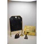 A Victorian style spot hammered brass slippers box; a brass two-handled candle carrier; a brass