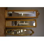 Three decorative wall mirrors.