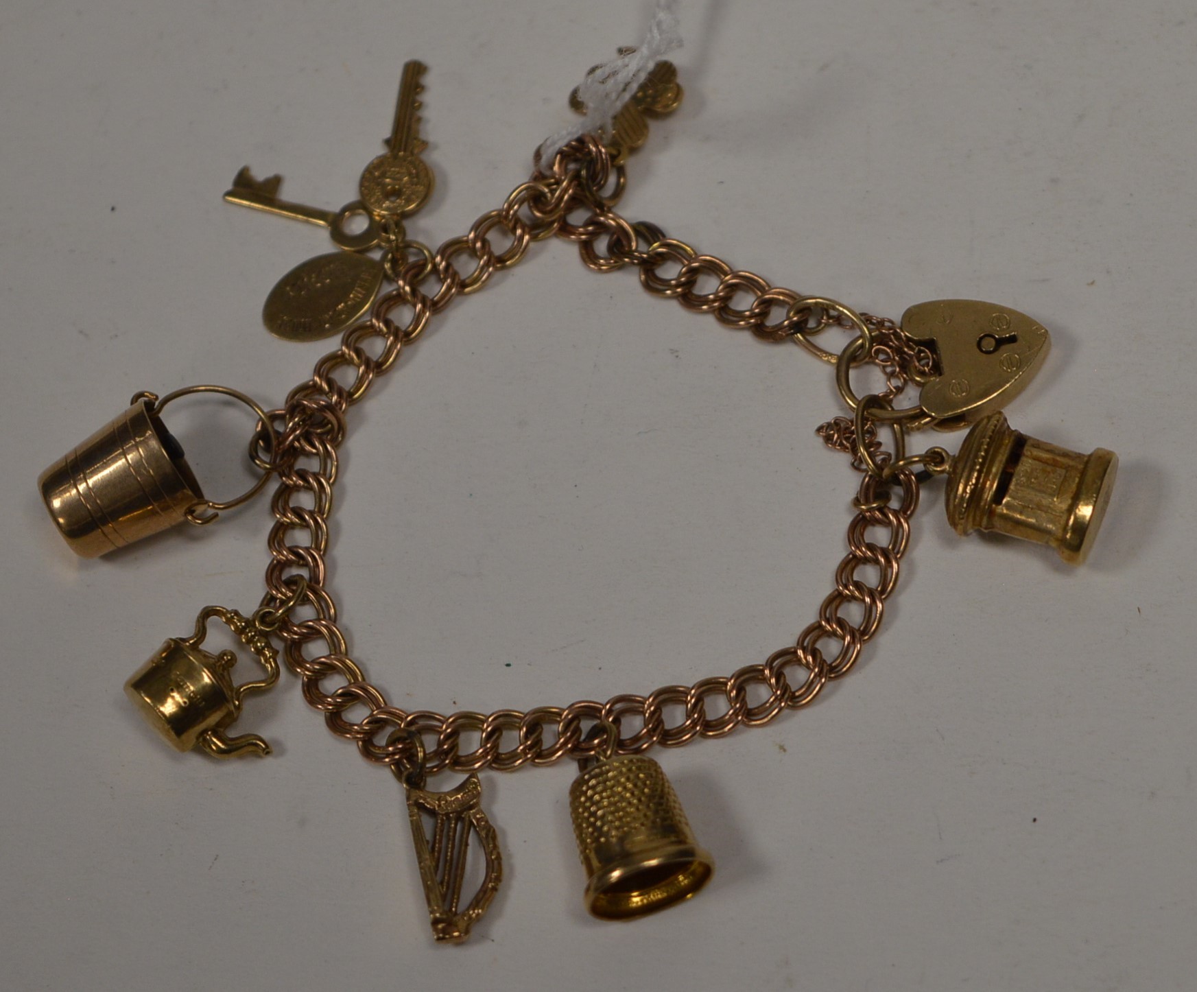 A 9ct yellow gold charm bracelet