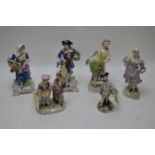 Porcelain figures in period costume, by Dresden and others.