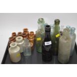 Selection of antique bottles and stoneware jars.